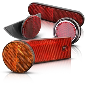 Varios reflectores de moto rojos y naranjas de diferentes formas.